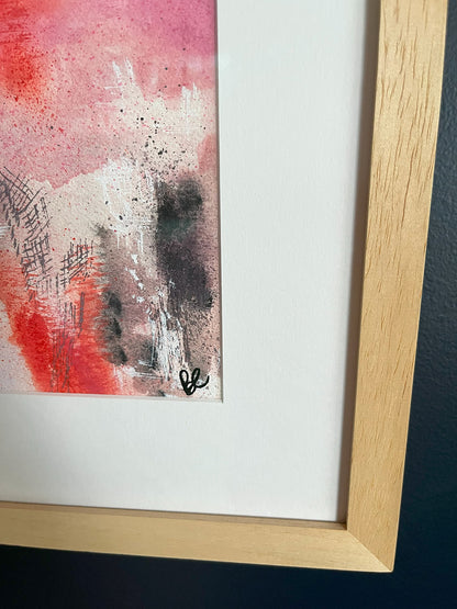 Close-up of Framed Watercolour Abstract called Uplift hanged on a dark blue wall