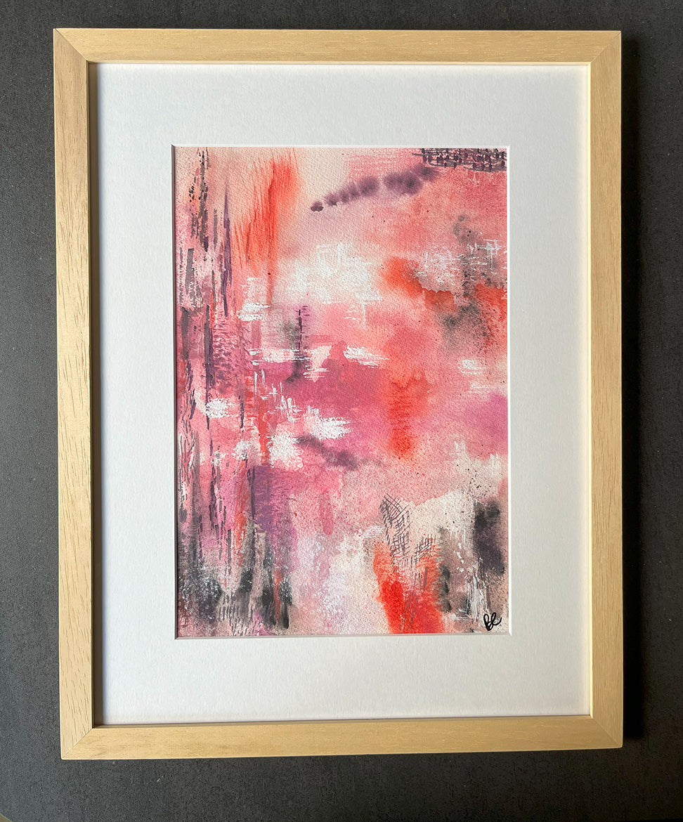 Framed Watercolour Abstract called Uplift hanged on a dark blue wall with plant