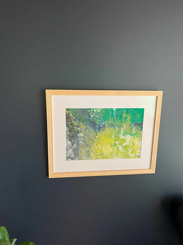  Framed Watercolour Abstract called Tenacity hanged on a dark blue wall