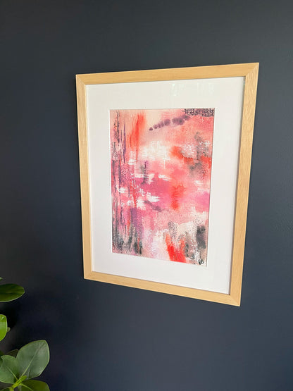 Framed Watercolour Abstract called Uplift hanged on a dark blue wall